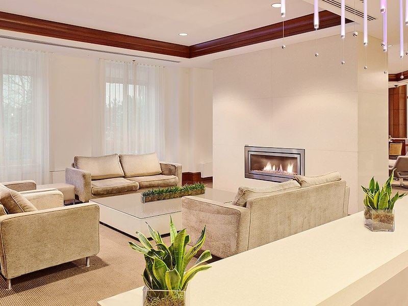A living room with couches and a fireplace